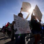 Dallas Protesters Rally Against President Trump, Elon Musk, and DOGE Over Federal Worker Cuts