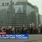 ICE protest draws thousands to Chicago Loop; car plows through early on – CBS News