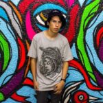 Teen’s T-Shirt Resembling Accused Killer Ignites Outrage After Trampling Memorial Outside Turning Point USA